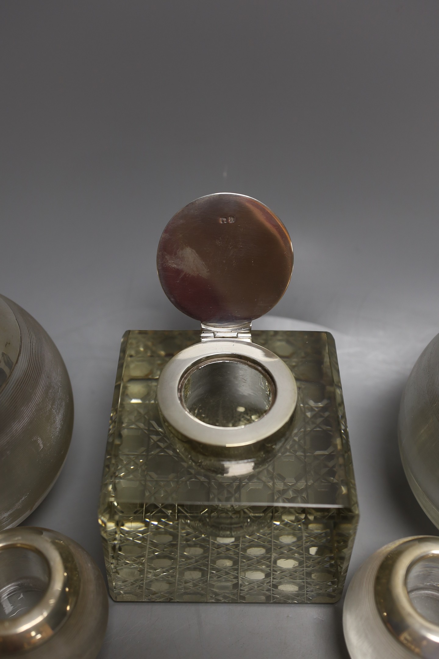 Two pairs of early to mid 20th century silver mounted ribbed glass match tidies, largest height 11cm and a silver mounted glass inkwell.